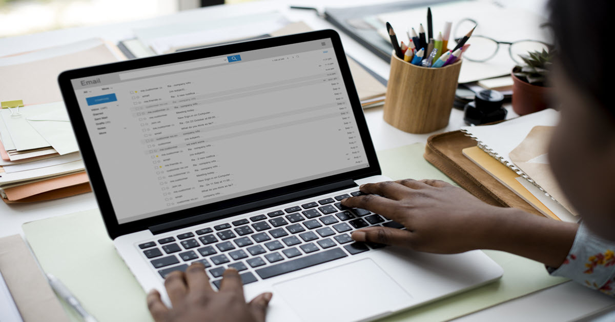 person typing on a laptop
